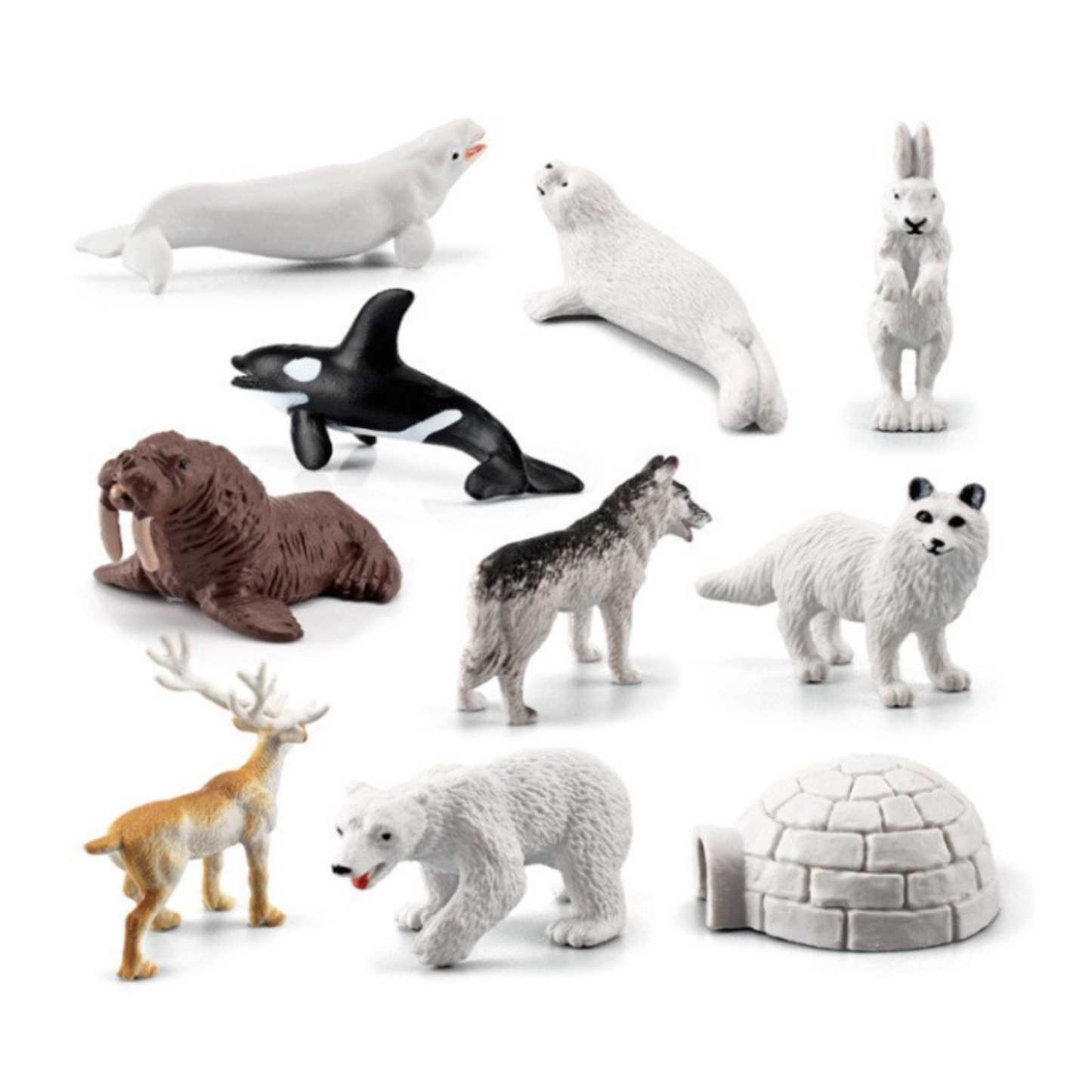 Collection of Arctic animal figurines on a white background
