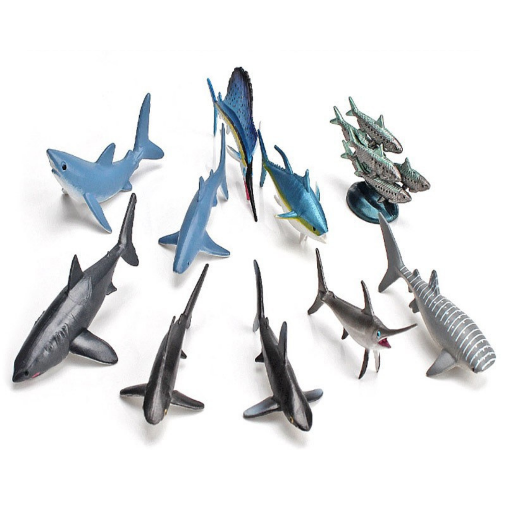 Collection of shark figurines on a white background