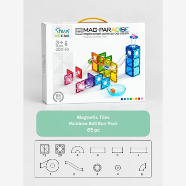 Team Stream Mag-Paradise Magnetic Building Tiles set in a white box with a yellow handle, shown above a green label reading 'Magnetic Tiles Rainbow Ball Run Pack 65 pc' and a diagram of track pieces below.
