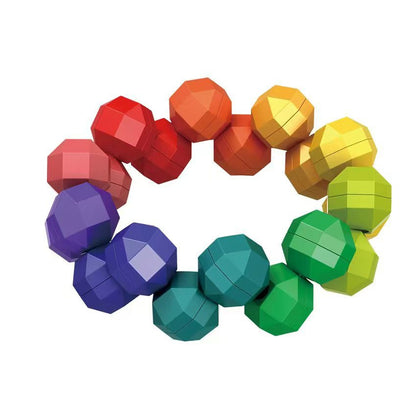 Alt-Text: A collage of multiple shapes created with a rainbow transformable fidget chain, including a star, a cube, and a heart-shaped puzzle.