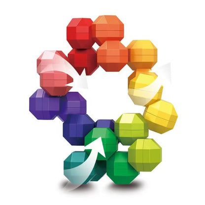 Close-up detail of the faceted rainbow segments and rotating joints of a geometric sensory fidget toy for tactile play.